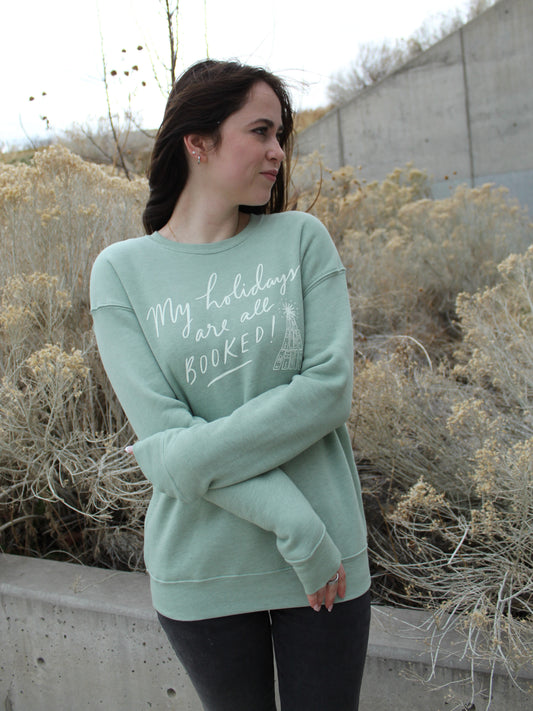 'My holidays are all BOOKED' Graphic Sweatshirt in Sage